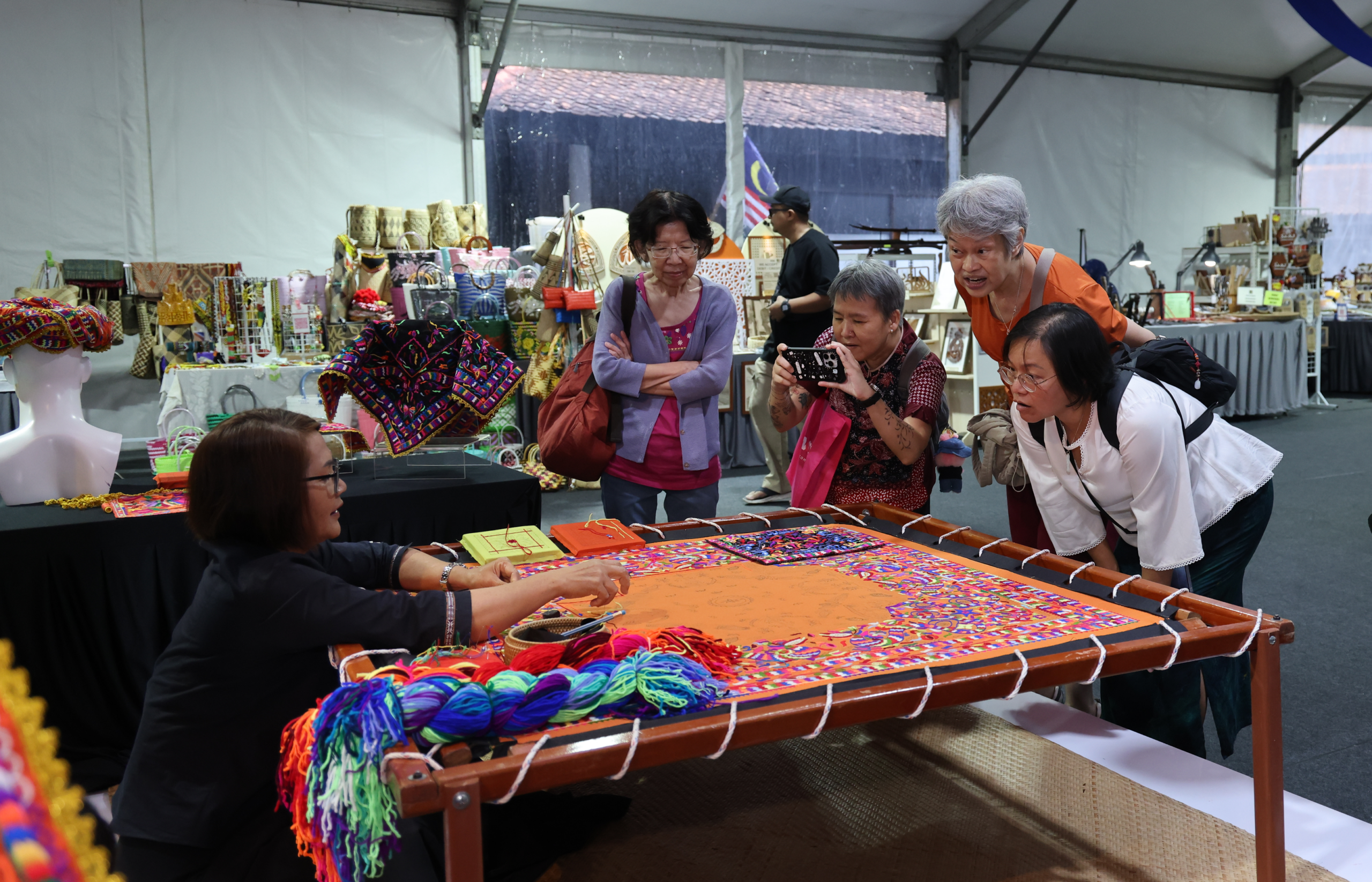 Visitors exploring the craft fair floor